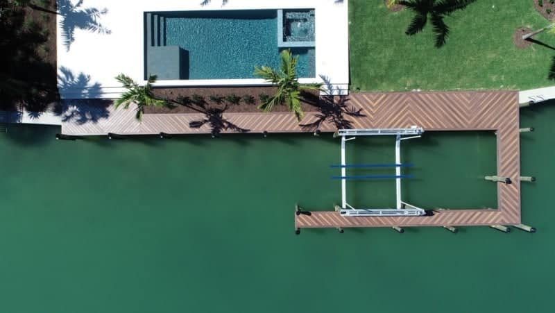 Top-down aerial view of a patterned deck on waterfront