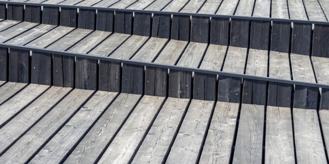 graying wood deck slanted stairs