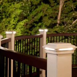 TREX TRANSCEND ® RAILING IN CLASSIC WHITE AND VINTAGE LANTERN WITH TREX® DECK LIGHTING™ POST CAP LIGHTS IN WHITE. , Lighting & Railing