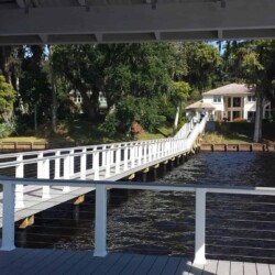Trex Deck Select decking in Pebble Gray. Trex Transcend Railing in White with Stainless Steel Cable. Trex Accent Lights on Posts. , Lighting & Railing