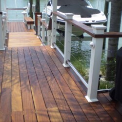 Decking: Ipe treated with Penofin oil, Azek Rail in White with Ipe top rail. Stainless steel cable. , Lighting & Railing