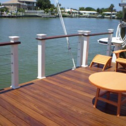 Decking: Ipe treated with Penofin oil, Azek Rail in White with Ipe top rail. Stainless steel cable. , Lighting & Railing